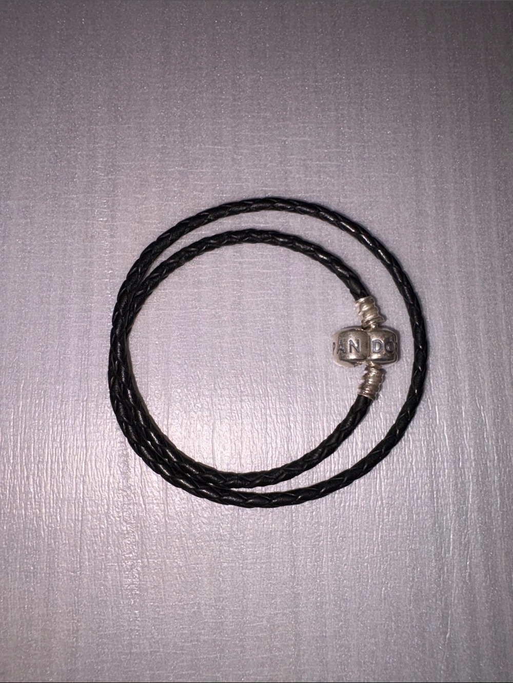 Pandora Black Braided Leather Bracelet with Silver Clousure.    Great Condition